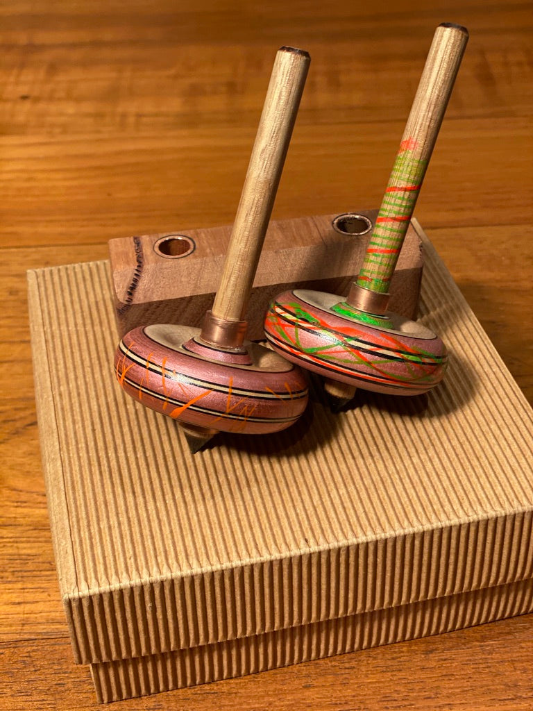 Spinning tops and stand